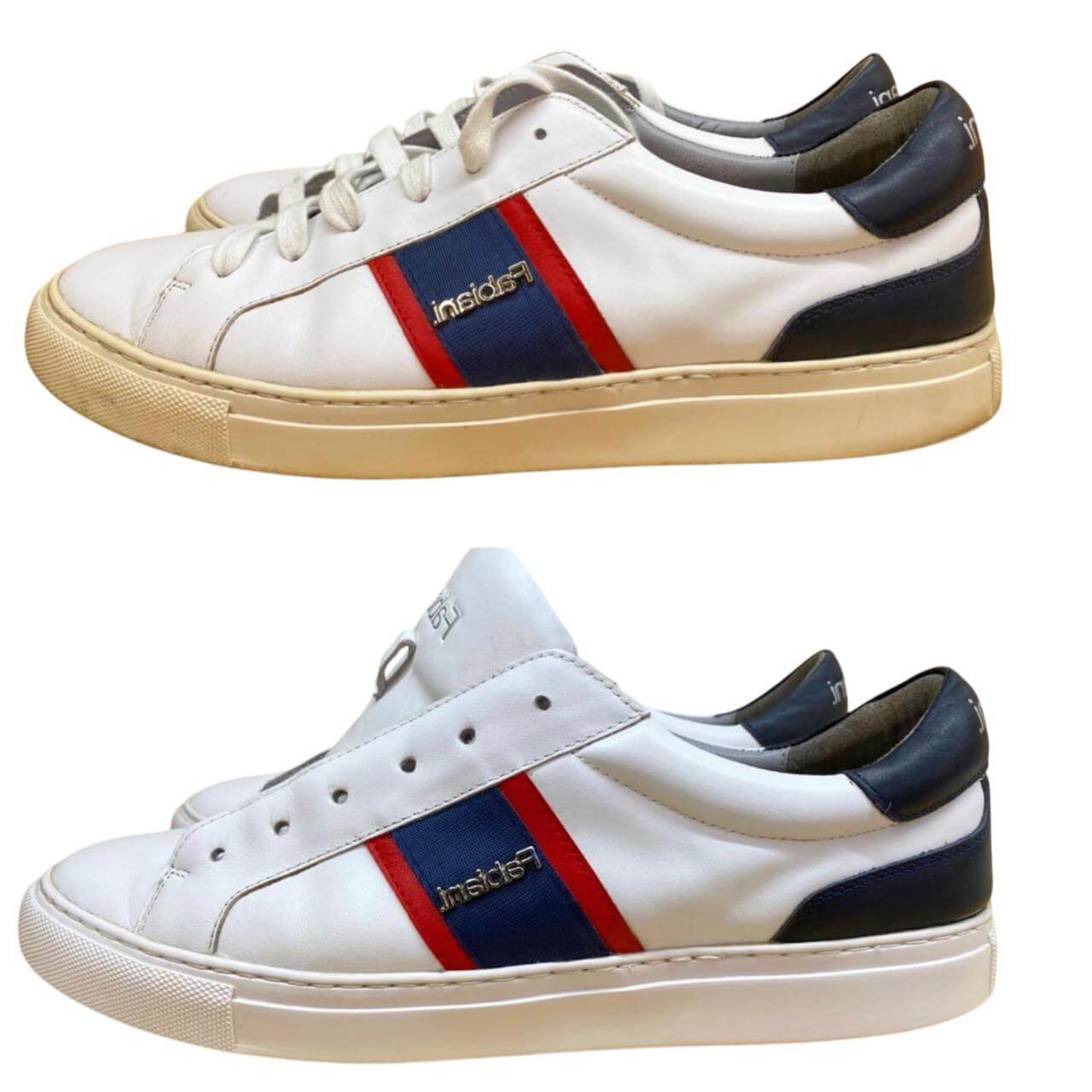 White sneakers with red and navy stripes, showcasing sneaker cleaning and restoration potential.